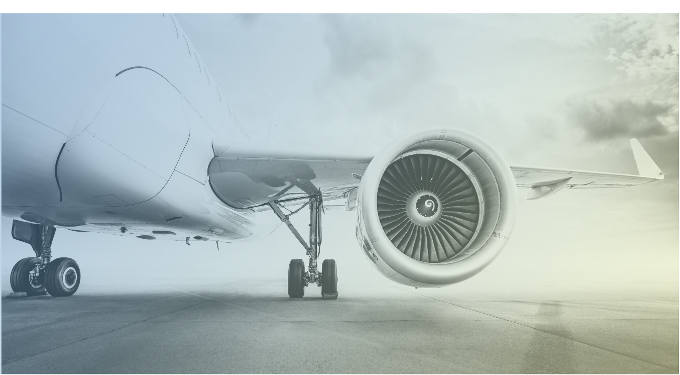A close-up of a commercial airplane's engine and landing gear on a runway under cloudy skies, featured in the Annual World Airport Traffic Dataset, 2025.